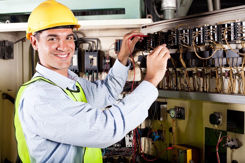 electrician working on industrial machine